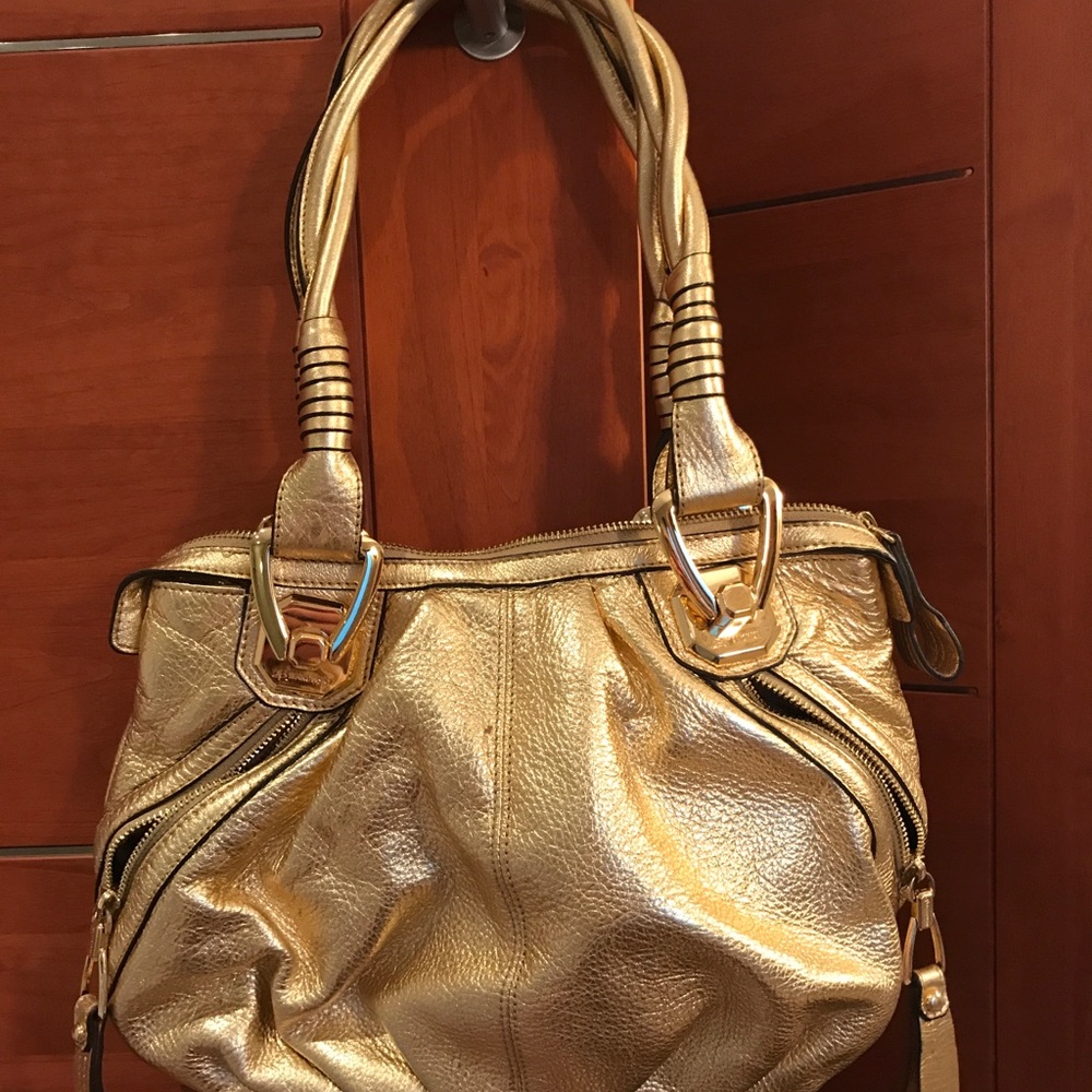 Barely used gold B. Makowsky bag